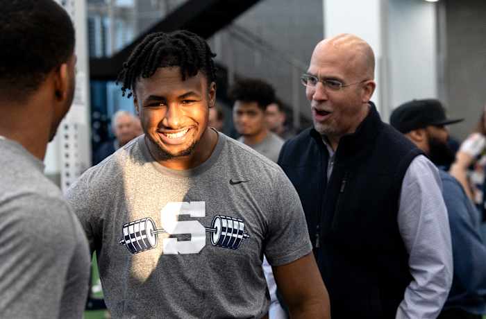 Penn State coach James Franklin encourages running back Nicholas Singleton during a max-out lifting session at the Lasch Football Building.